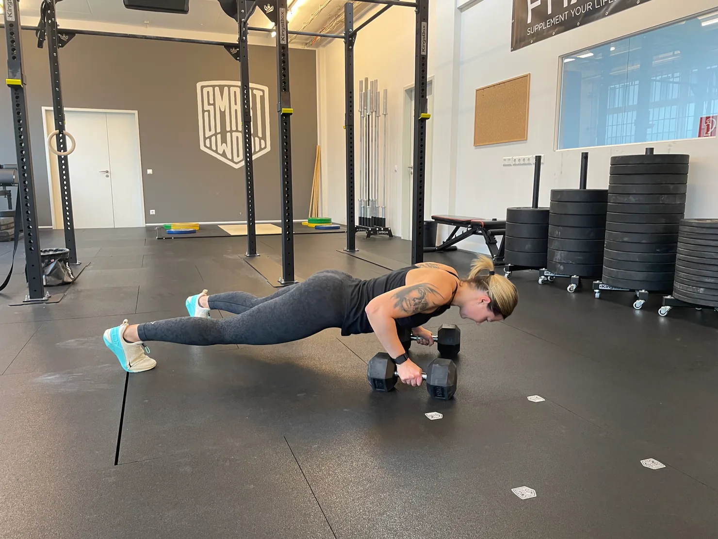 Athlete training with dumbbells