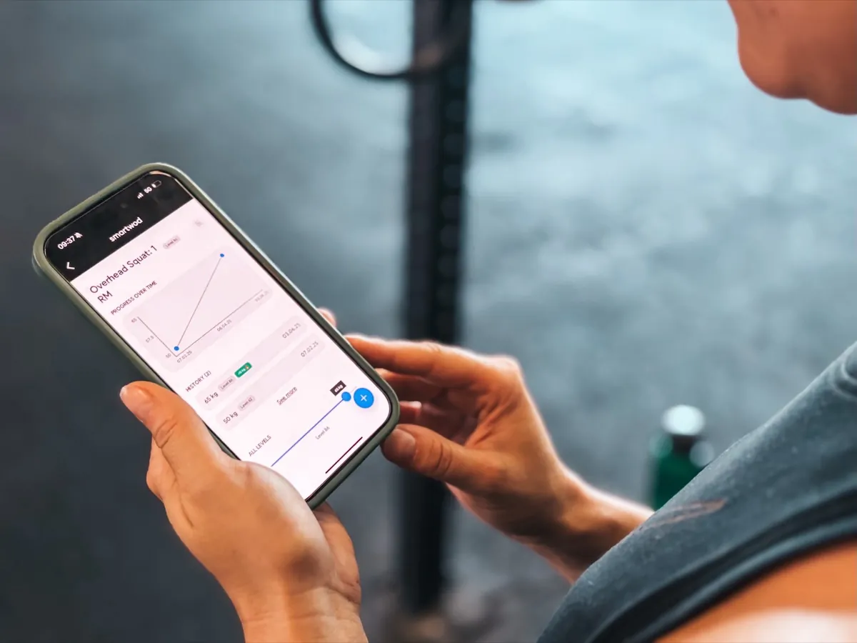 Phone showing the PR progress screen in the SmartWOD Workout Generator