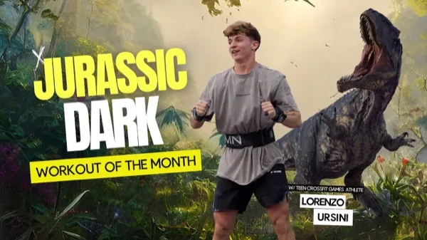 SmartWOD Workout of the Month Jurassic Dark: Lorenzo Ursini in front of a jungle backdrop with a T-Rex