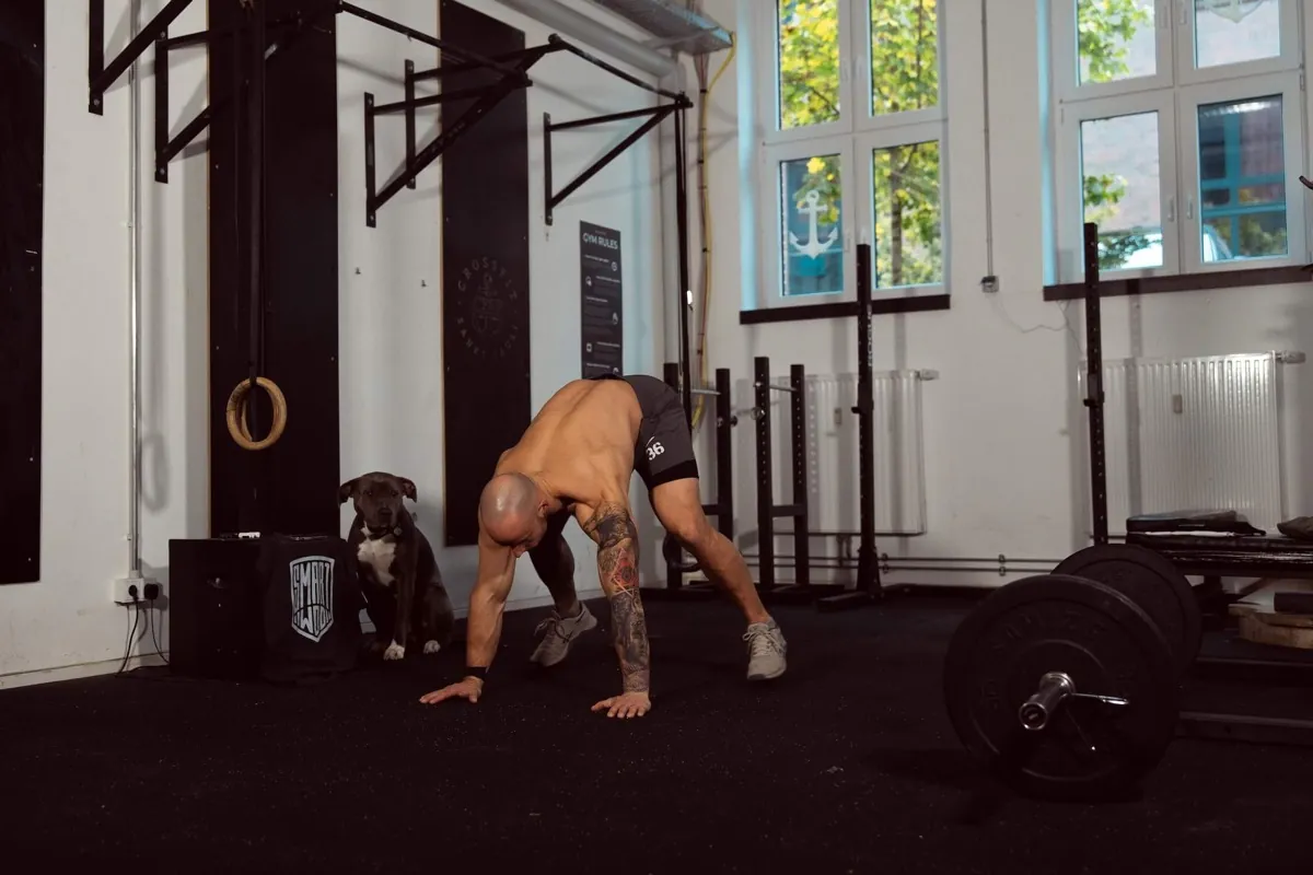Athlete doing burpees in a CrossFit box