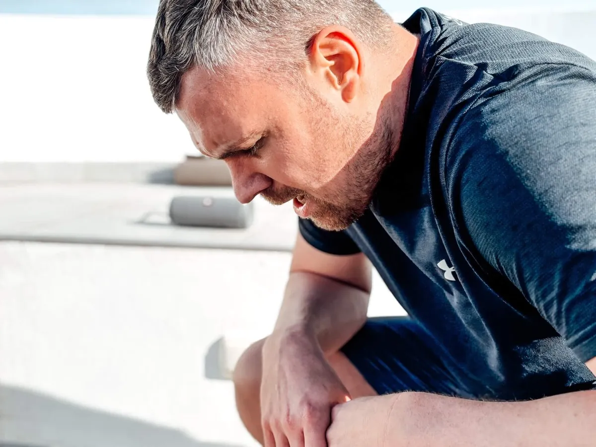 Exhausted athlete catching their breath after an intense workout