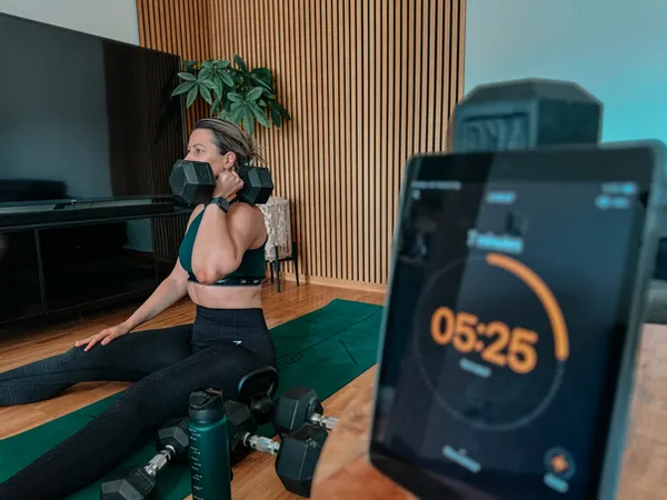 Woman training with a dumbbell